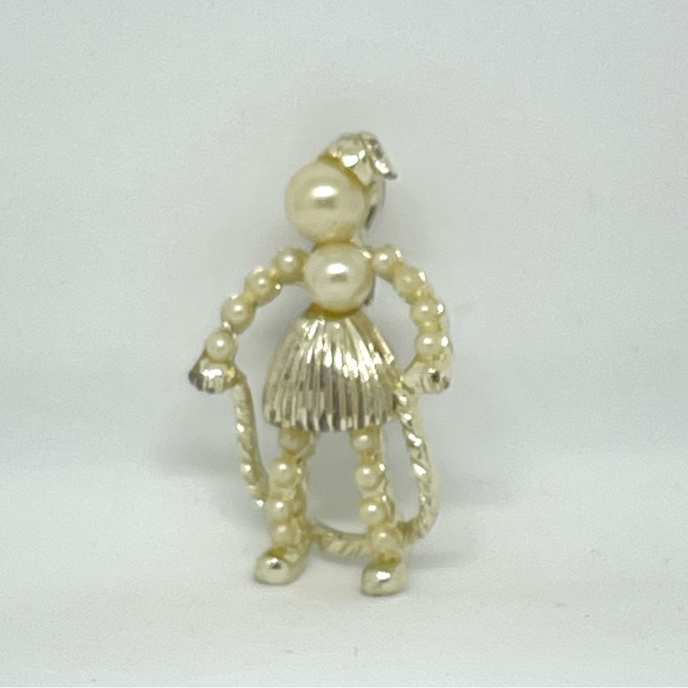 Unbranded Faux Pearl, and Gold Tone Figure with Jump Rope Brooch